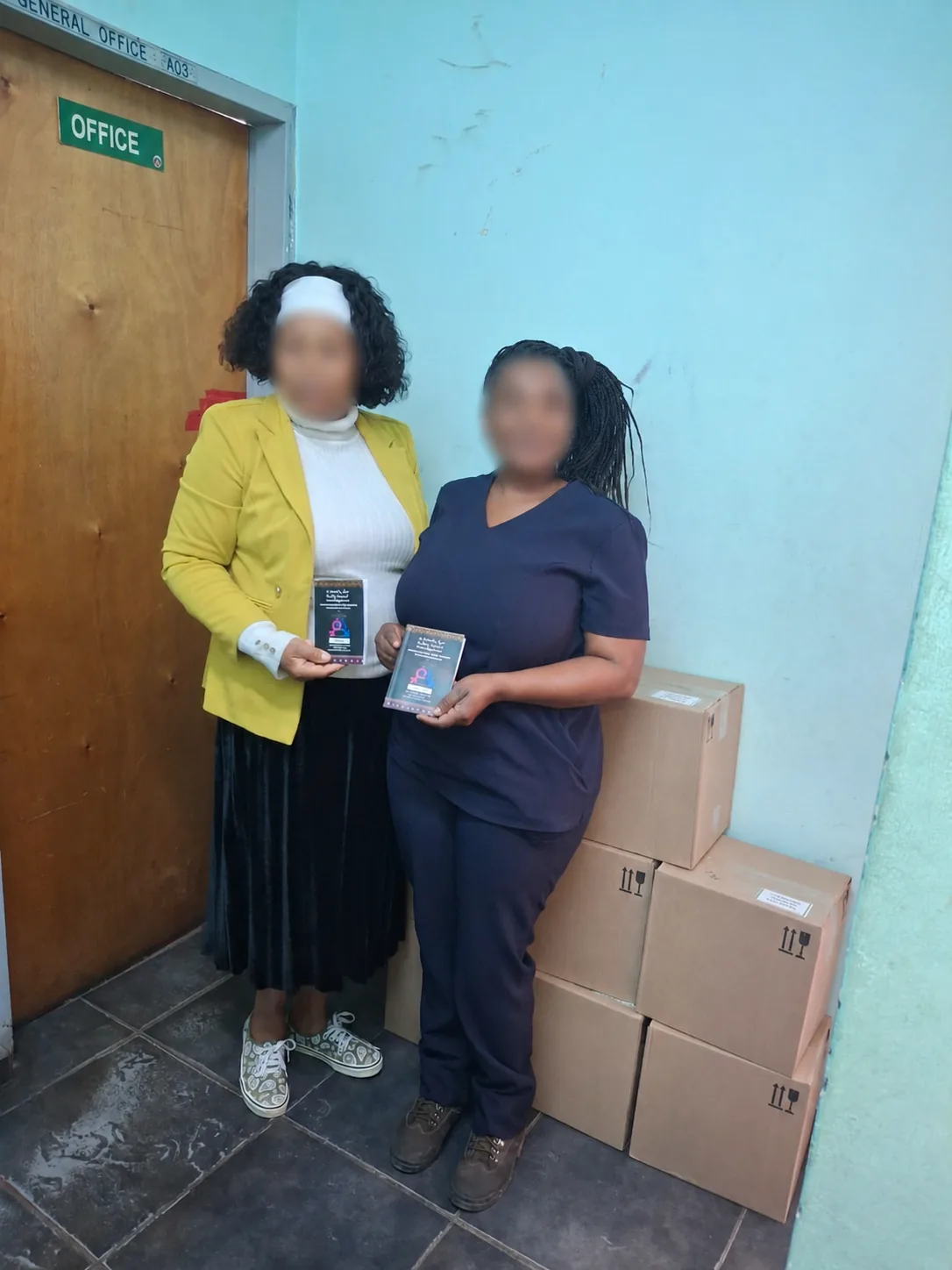 Bulk Educational Booklet Printing for School Distribution – Case Study Printed educational booklets at school distribution point with faces blurred for privacy