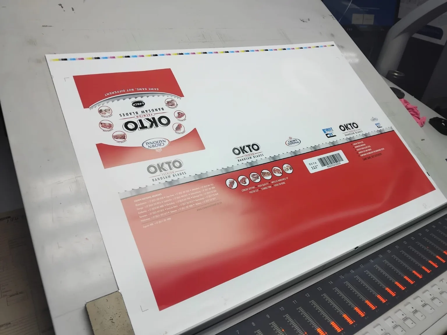 Custom Printed Corrugated Boxes for First Cut – OKTO Premium Bandsaw Blades OKTO packaging sheet during full colour lithographic printing production