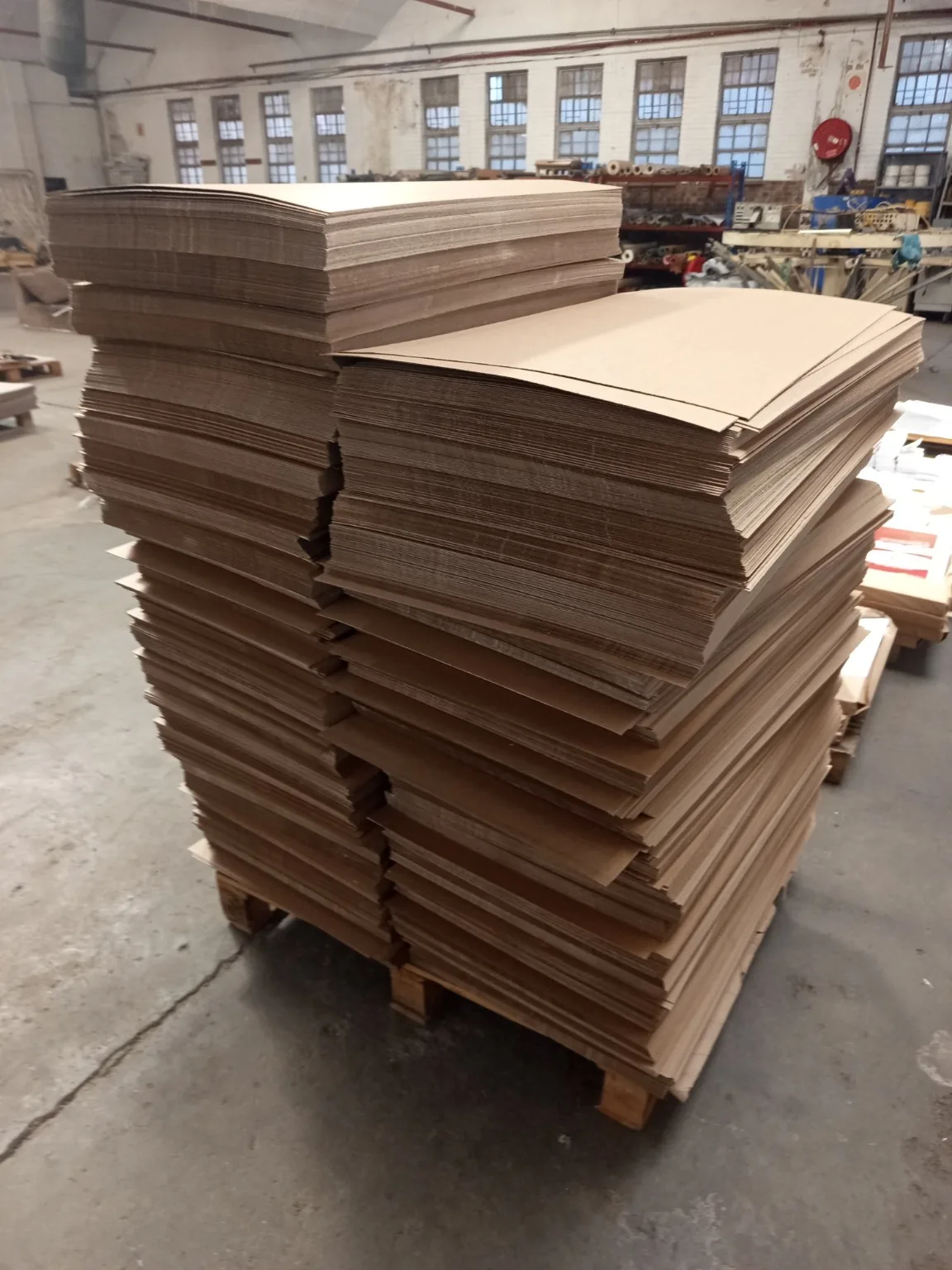 Custom Printed Corrugated Boxes for First Cut – OKTO Premium Bandsaw Blades E-flute corrugated board stacked for custom packaging production in Johannesburg