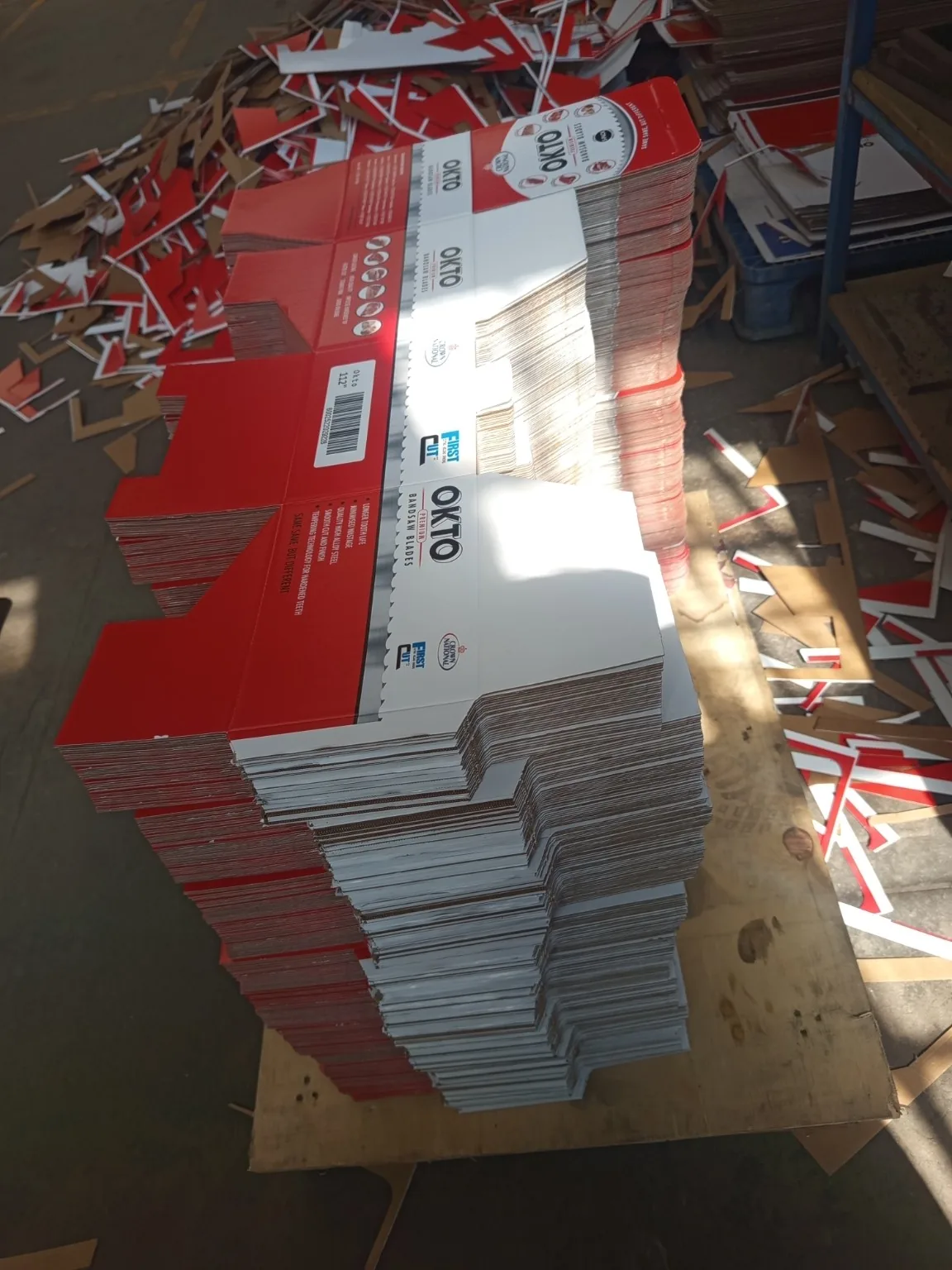 Custom Printed Corrugated Boxes for First Cut – OKTO Premium Bandsaw Blades Bulk production stack of custom printed packaging blanks for First Cut