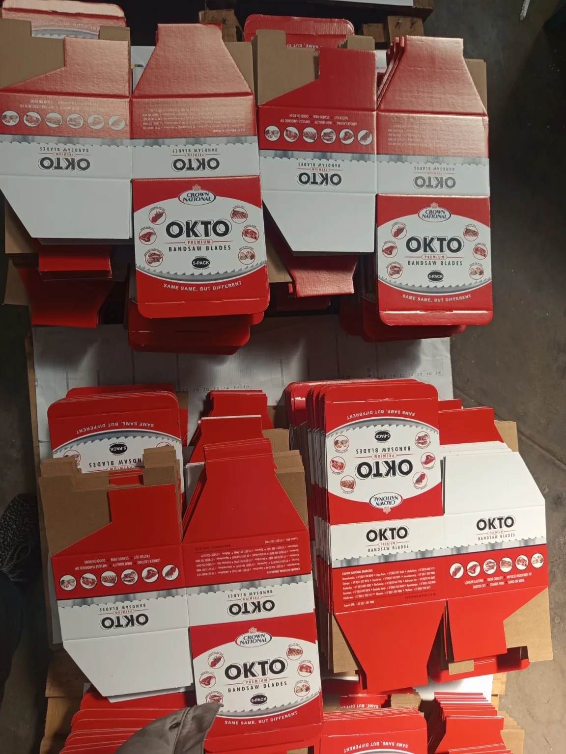 Custom Printed Corrugated Boxes for First Cut – OKTO Premium Bandsaw Blades Partially assembled custom printed OKTO boxes during folding and conversion