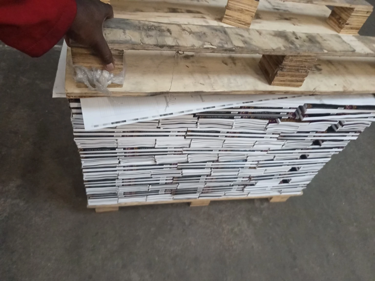 Close-up of bulk booklet finishing process at Print Norwood Johannesburg