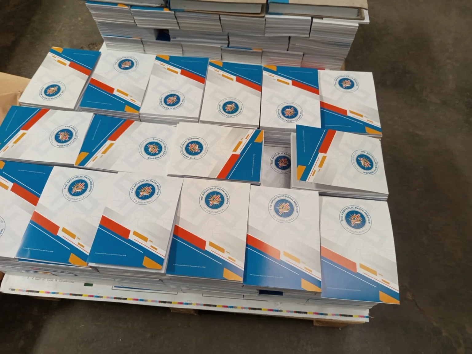 Top view of finished branded notepads stacked after commercial production