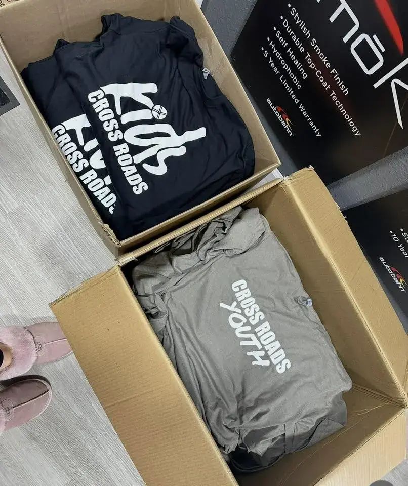 Bulk branded hoodies packed together with finished logo branding