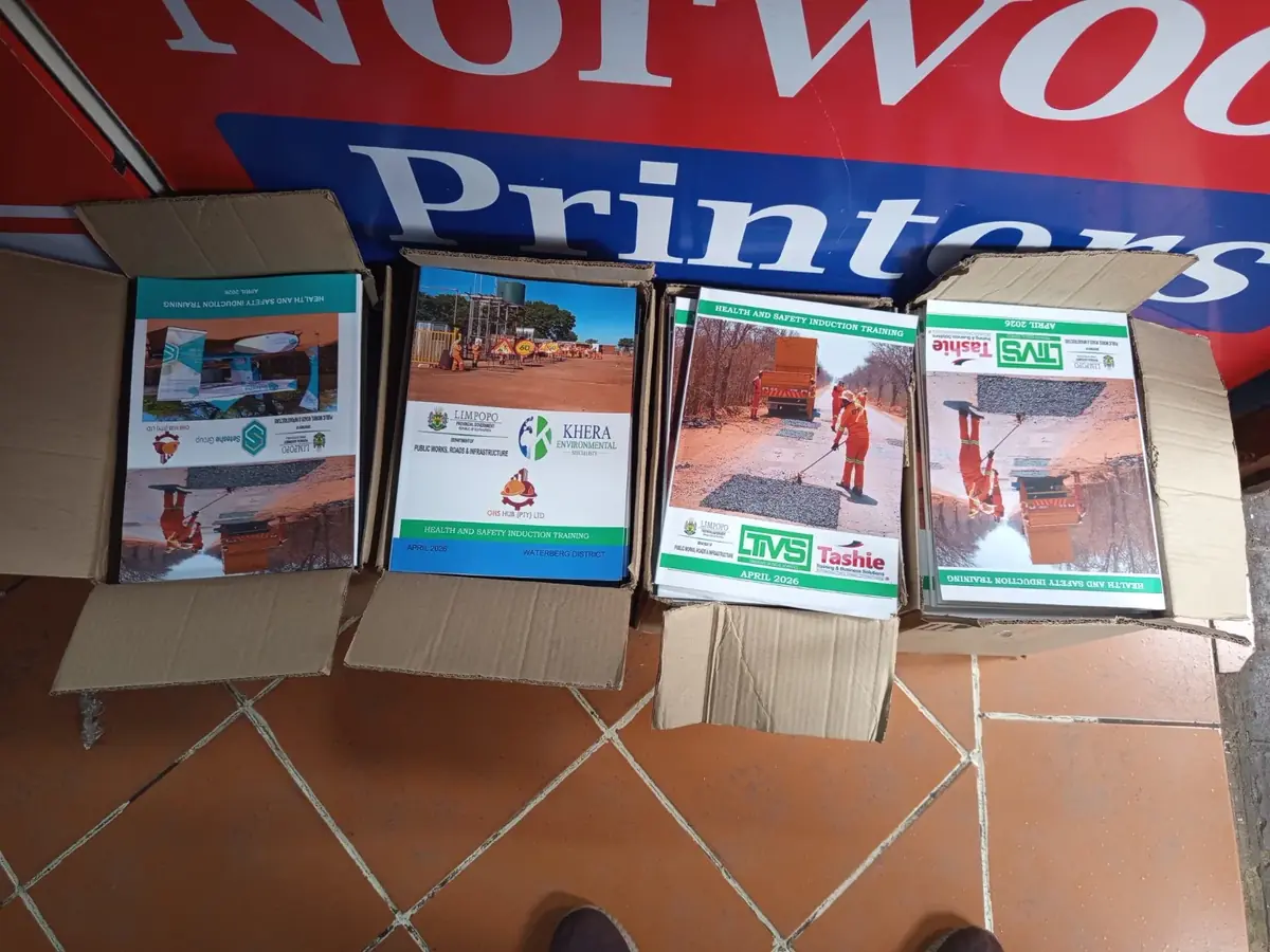 Multiple versions of printed training manuals organised in separate cartons for distribution